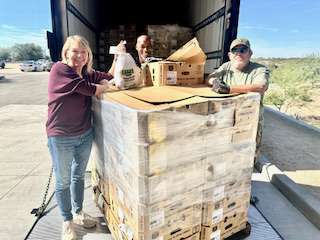Executive Director of the Foothills Food Bank Leigh Zydonik turkey delivery