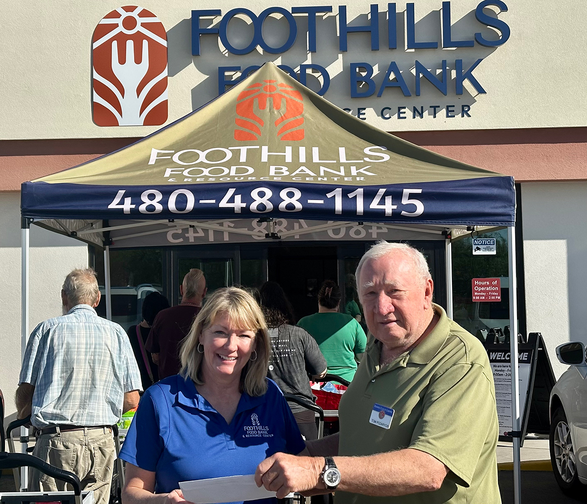 Kiwanis Funds Request Committee's presents Foodbank with grant check